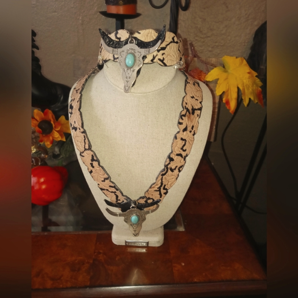 Leather tooled jewelry set.